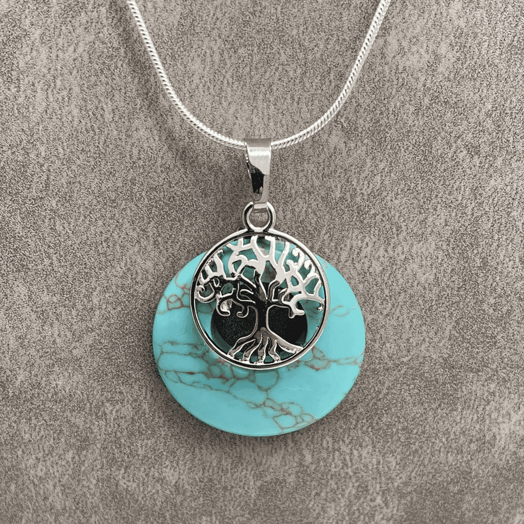 Turquoise Donut Stone with a Platinum Tone Tree of Life Pendant 